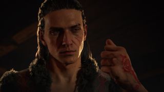 A crop of Coen looking at his closed fist in The Blood of Dawnwalker