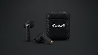 Pair of Marshall Minor III earbuds and case on a dark background