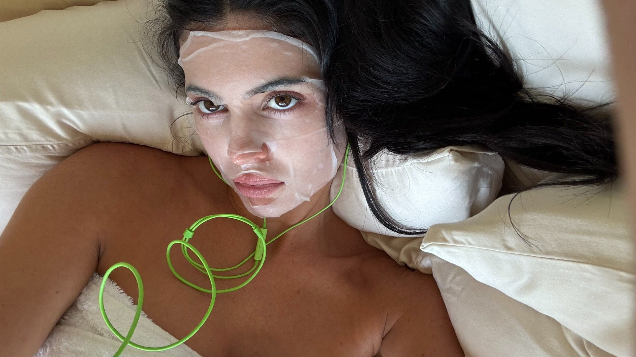 Kylie Jenner wearing a sheet mask.