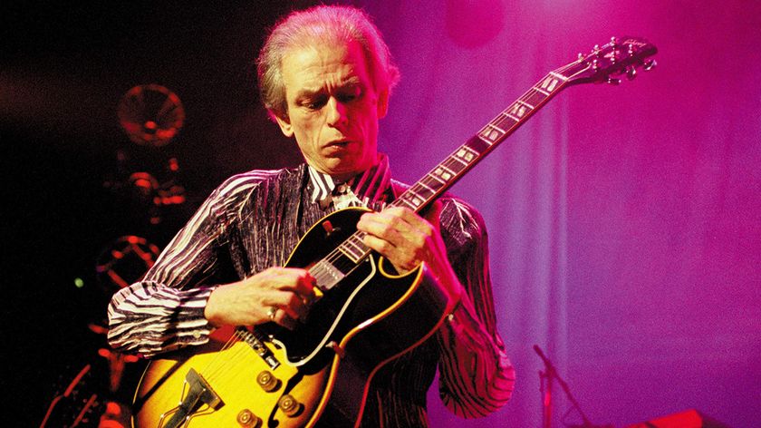 Steve Howe performing live onstage, playing Gibson ES-175 guitar