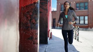 Suunto vs Garmin: person running in an urban environment