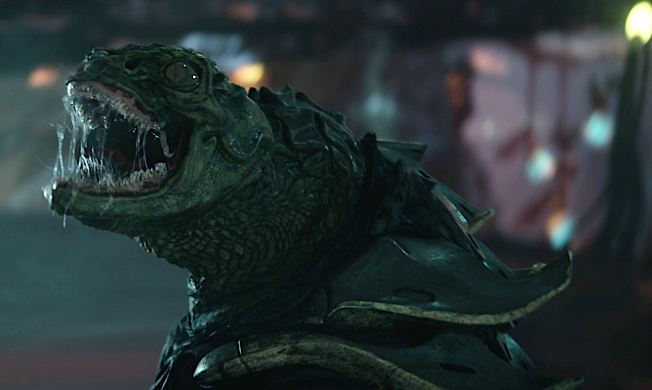 A snarling alien lizard creature with sharp teeth