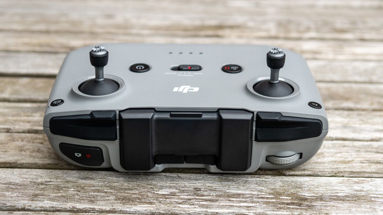 A controller for the DJI Air 2S drone on a wooden table