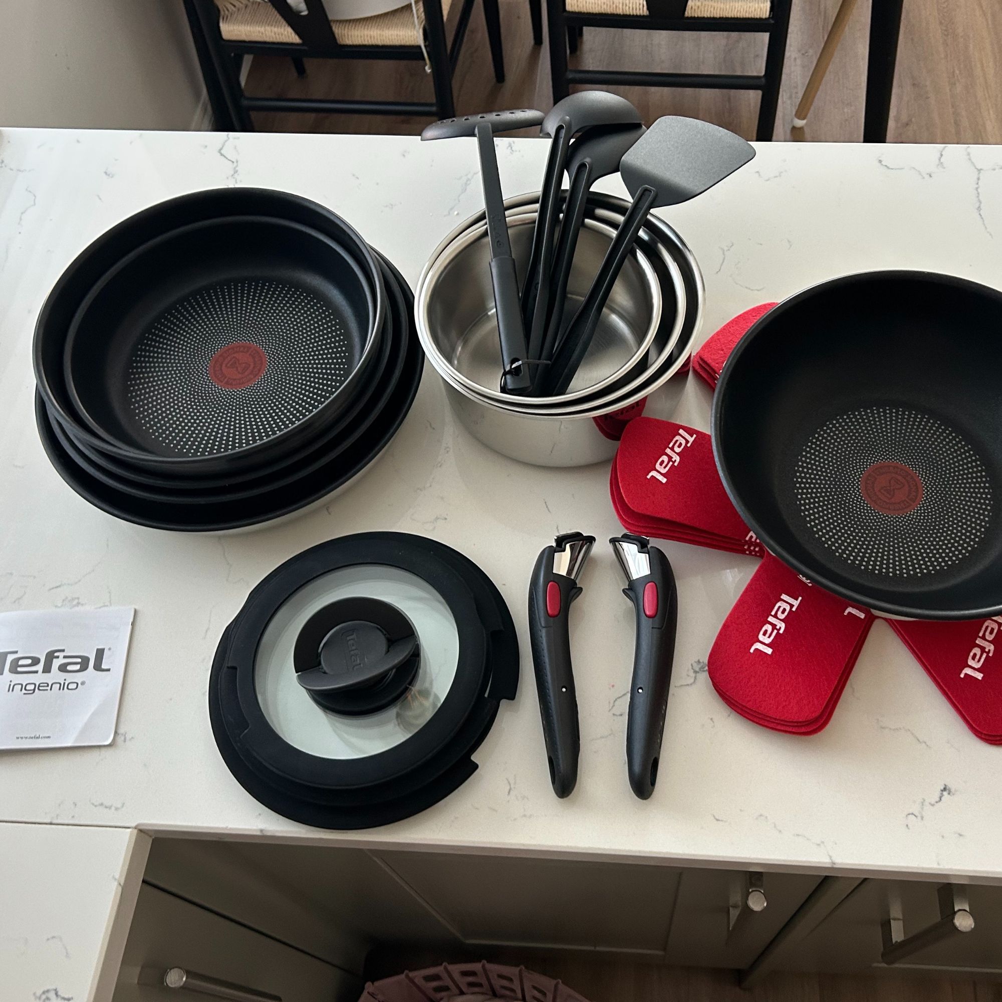 Tefal Ingenio Emotion 22-Piece Pan Set - contents of box on kitchen side