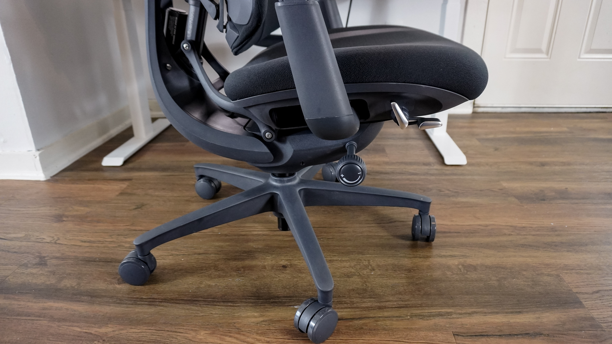 The adjustment levers and knobs on the left side of the LiberNovo Omni office chair