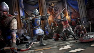 A knight in blue holding a maul and a knight in red with a sword are prepared to swing at one another at the center of a throne room while other red and blue teammates fight nearby.