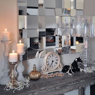 living room console table with candlesticks clock and lamp mirror