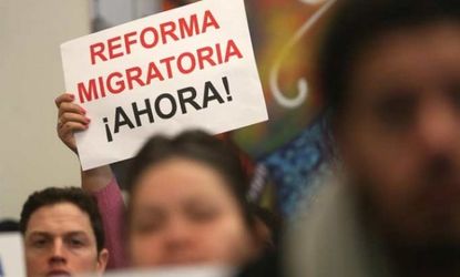 A person holds a sign written in Spanish reading "Immigration Reform Now" during a watch party of President Obama's speech on Jan. 29.