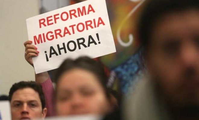 A person holds a sign written in Spanish reading &amp;quot;Immigration Reform Now&amp;quot; during a watch party of President Obama&amp;#039;s speech on Jan. 29.