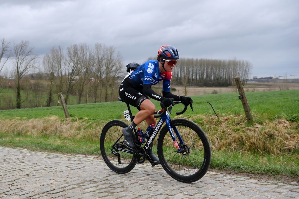NINOVE BELGIUM FEBRUARY 24 Nina Buijsman of The Netherlands and Team FDJSuez competes passing through a cobblestones sector during the 16th Omloop Het Nieuwsblad 2024 Womens Elite a 1271km one day race from Ghent to Ninove UCIWWT on February 24 2024 in Ninove Belgium Photo by Alex BroadwayGetty Images
