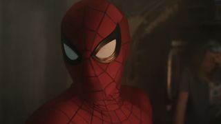 Spider-Man in the Brand New Day trailer with a tank behind him. 