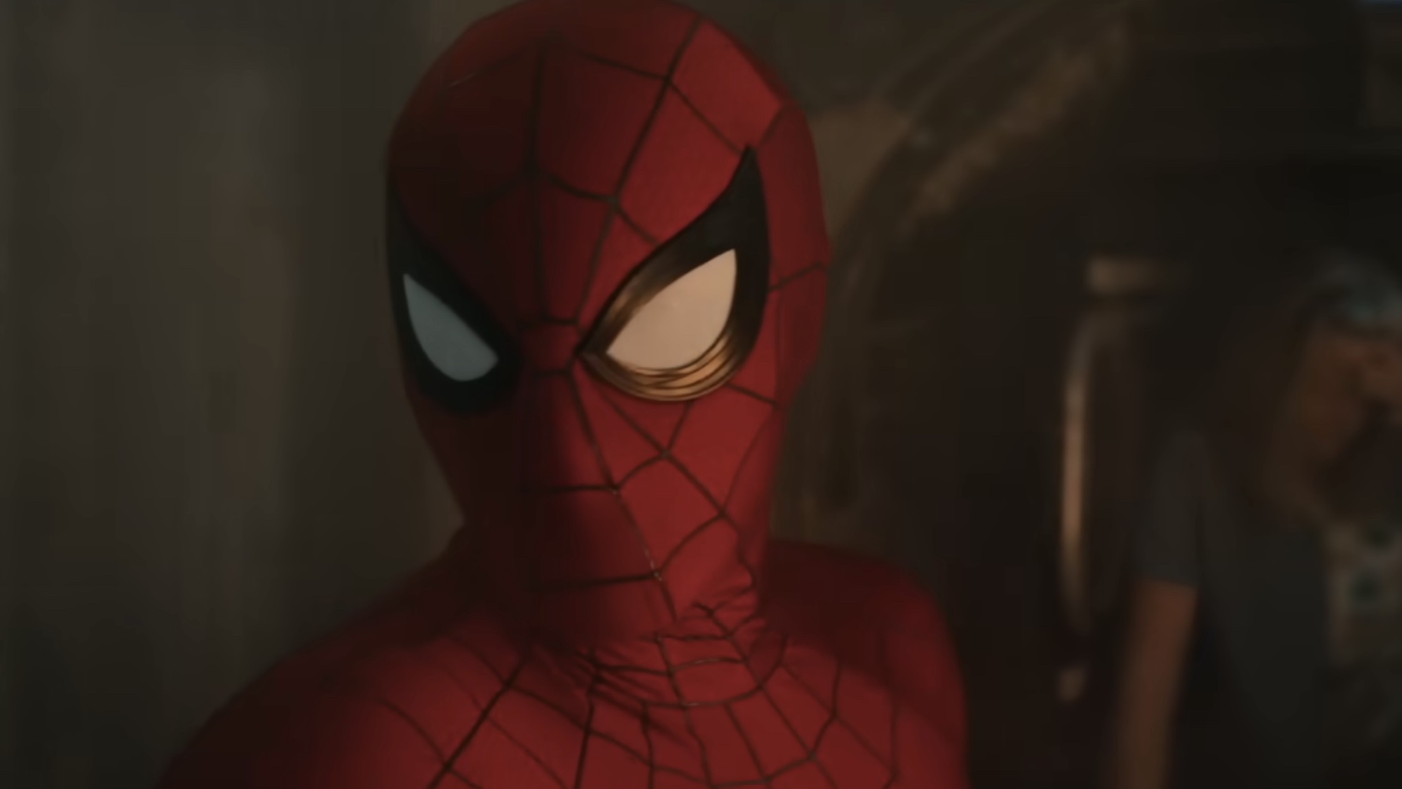 Spider-Man in the Brand New Day trailer with a tank behind him. 
