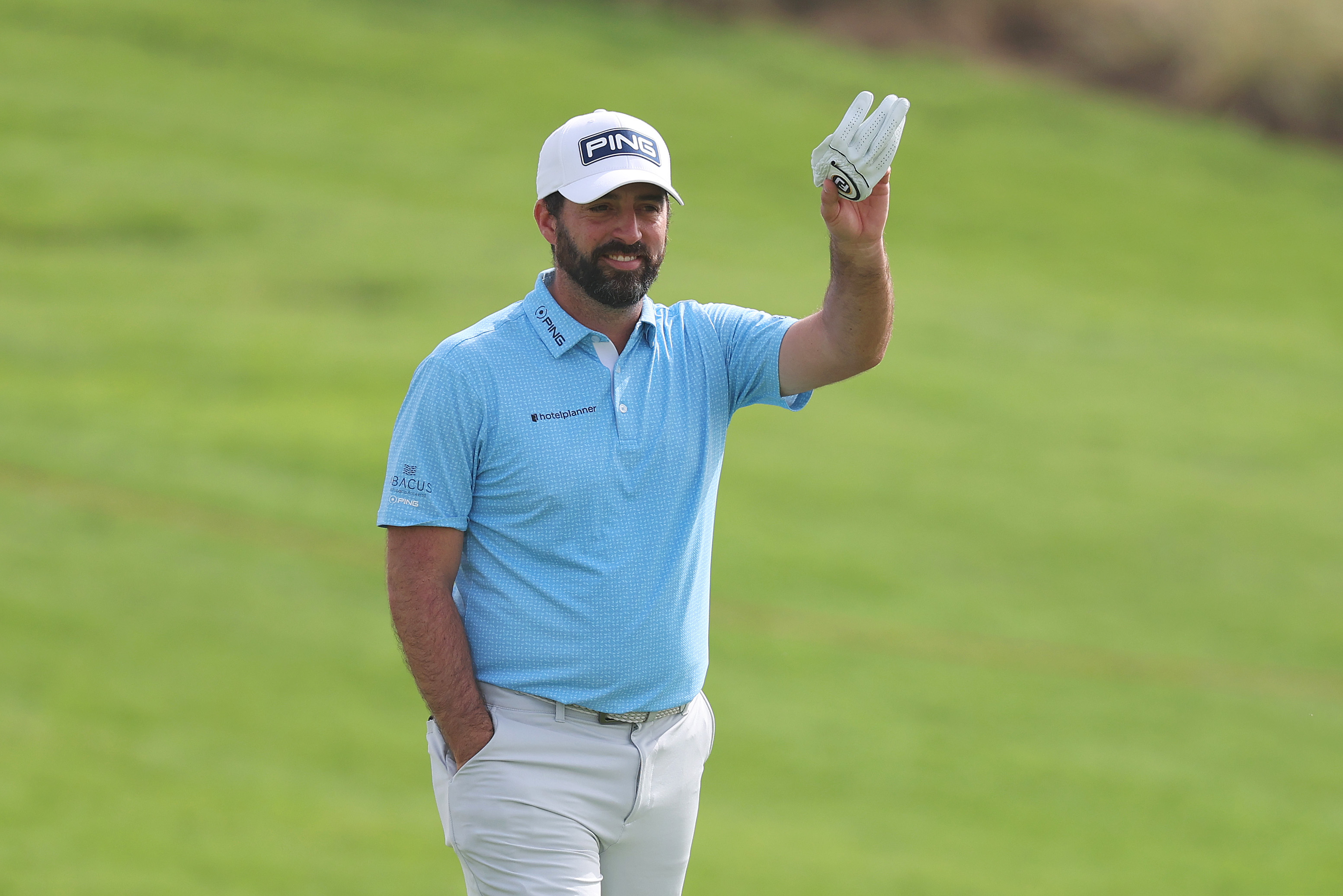 John Parry waves to the crowd