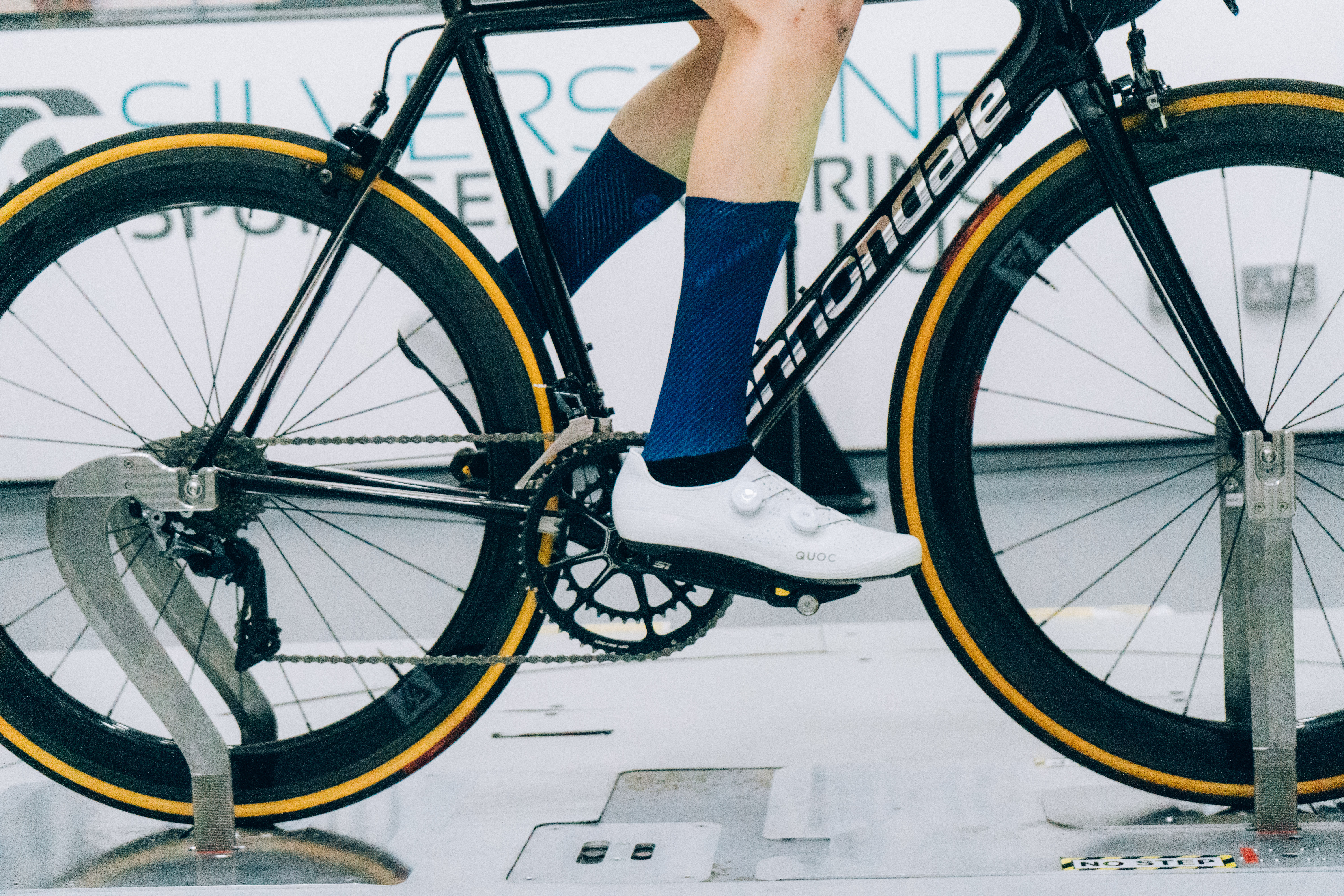 A close up of the socks that Tom is wearing while riding a bike in the wind tunnel
