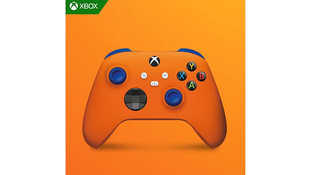An orange Fanta-branded Xbox controller