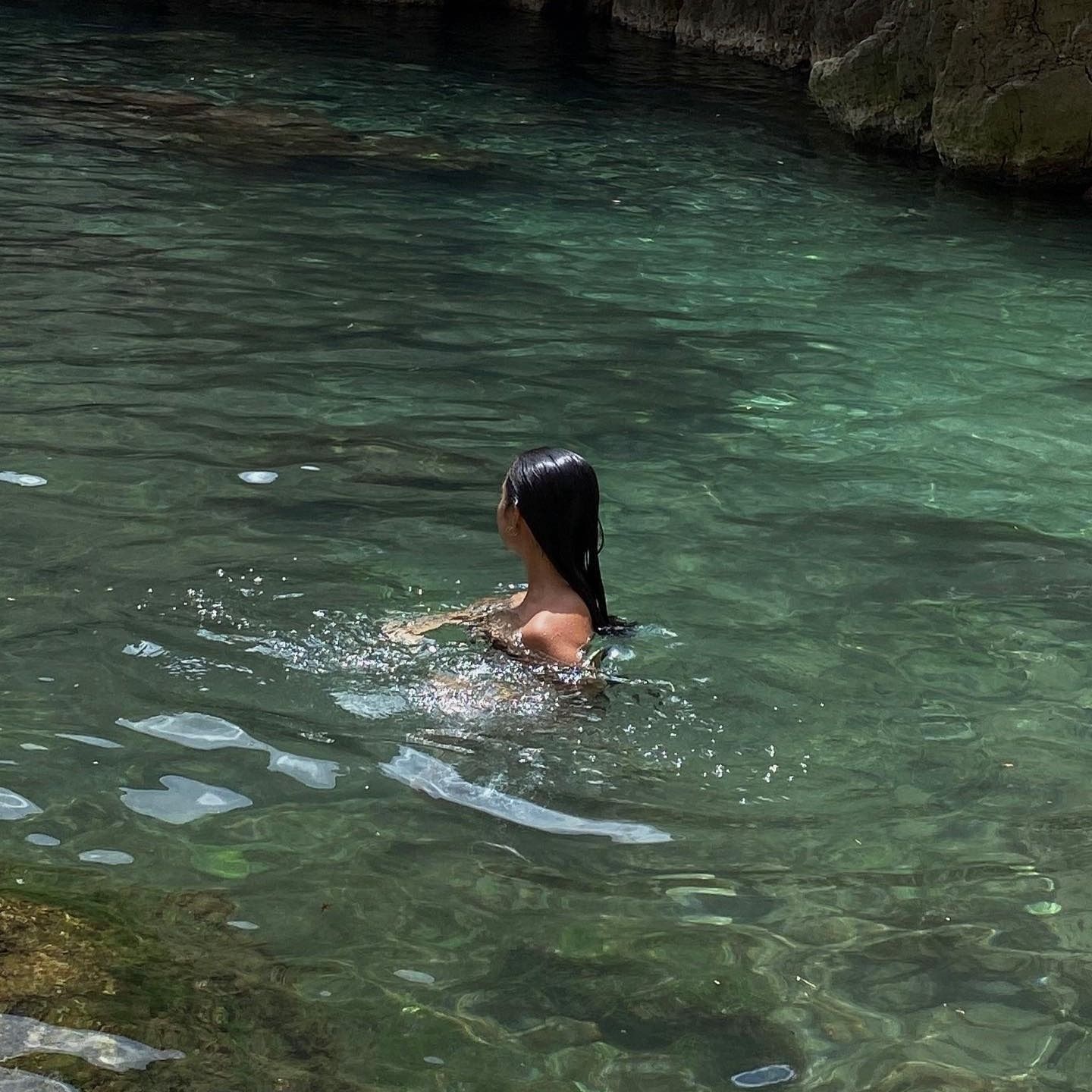 Woman swimming in water