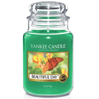 green colour yankee candle in glass jar