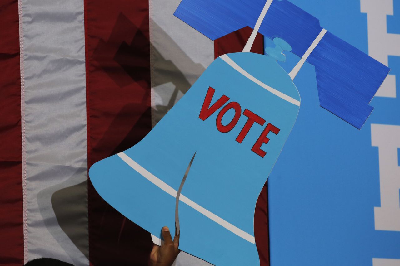 A sign depicting the Liberty Bell with the word &amp;quot;vote.&amp;quot;