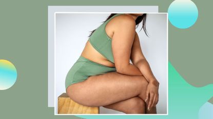 side view of woman with brown skin sitting on stool with legs crossed wearing a sage underwear set