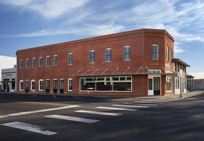 exterior of Judd Foundation North Apartments in Marfa with timber furniture and domestic styling