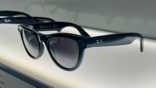 Graphite Ray-Ban Meta (Gen 2) glasses on display from a side view