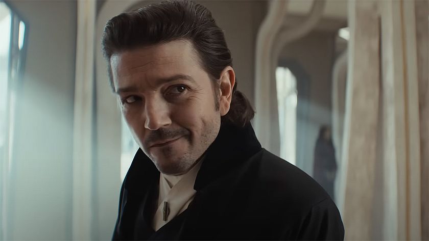 Cassian raising a wry smile as he checks into a hotel on Ghorman in Andor season 2