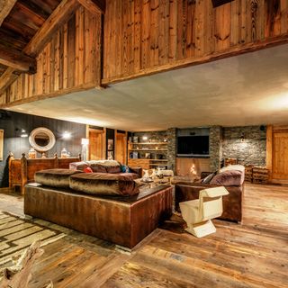 chalet exterior expansive lounge with feature fireplace