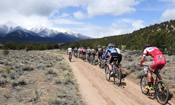 Riders on a flat fire road.