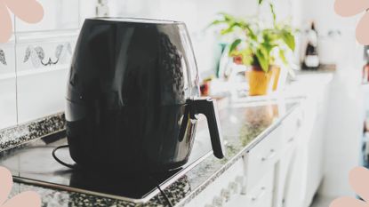 An air fryer sat on a kitchen countertop illustrating What you need to know before buying an air fryer