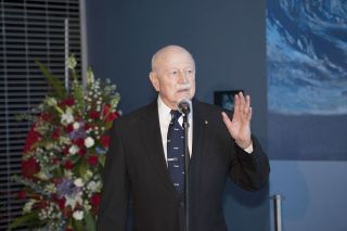 Gerald "Jerry" Carr speaks at a 2014 wreath laying ceremony for his late Skylab 4 crewmate Bill Pogue at the U.S. Astronaut Hall of Fame at Kennedy Space Center in Florida.