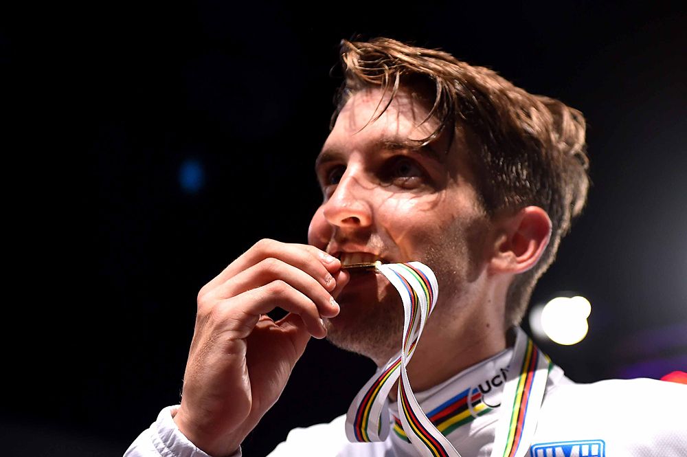 Kevin Ledanois (France) bits the gold medal