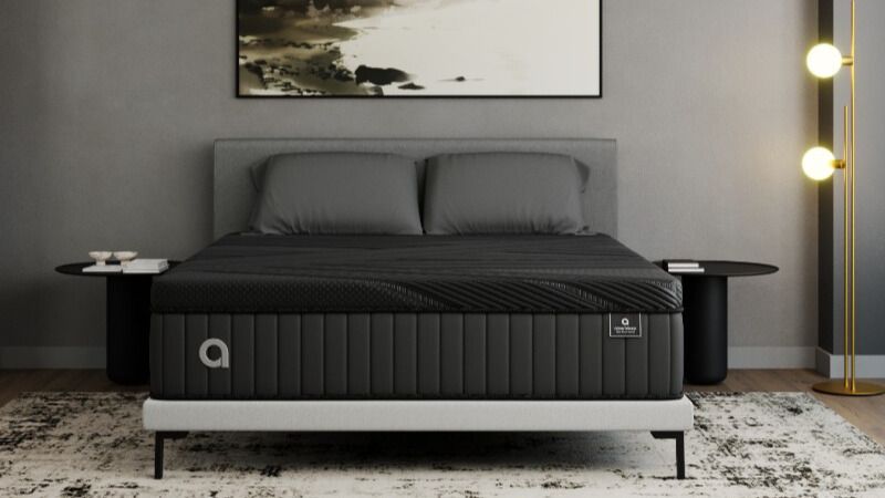 The Amerisleep AS6 black mattress in a bedroom