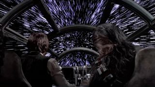 Han Solo and Chewbacca in the Millennium Falcon as it jumps to hyperspace.