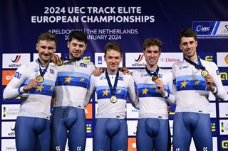 Daniel Bigham, Charlie Tanfield, Ethan Hayter, Oliver Wood, Ethan Vernon celebrate with gold medals on the podium for the Men's Team Pursuit finals 