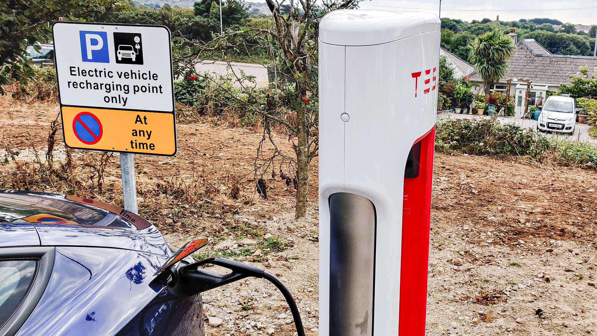 Tesla Model 3 charging at station