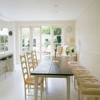 dining room with white door and white wall