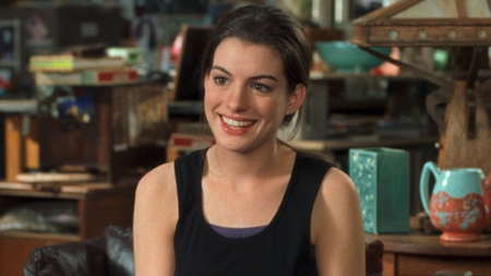Anne Hathaway smiling as Mia Thermopolis with a tank top on in The Princess Diaries