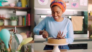 Nadiya creating something delicious on Nadiya Bakes.