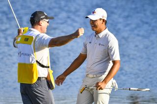 Mark Carens and Si Woo Kim embrace after winning the 2017 Players Championship