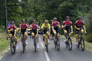 Egan Bernal in yellow surrounded by Team Ineos stage 21 at the Tour de France