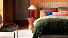colorful bedroom with round bedside table