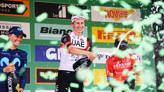 COMO ITALY OCTOBER 08 LR Enric Mas Nicolau of Spain and Movistar Team on second place race winner Tadej Pogacar of Slovenia and UAE Team Emirates and Mikel Landa Meana of Spain and Team Bahrain Victorious on third place celebrate on the podium ceremony after the 116th Il Lombardia 2022 a 253km one day race from Bergamo to Como iLombardia on October 08 2022 in Como Italy Photo by Tim de WaeleGetty Images