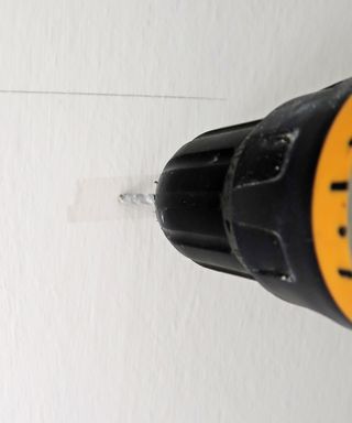 drilling holes to hang a shelf