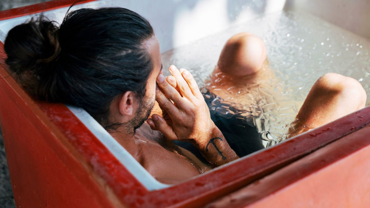 man taking an ice bath