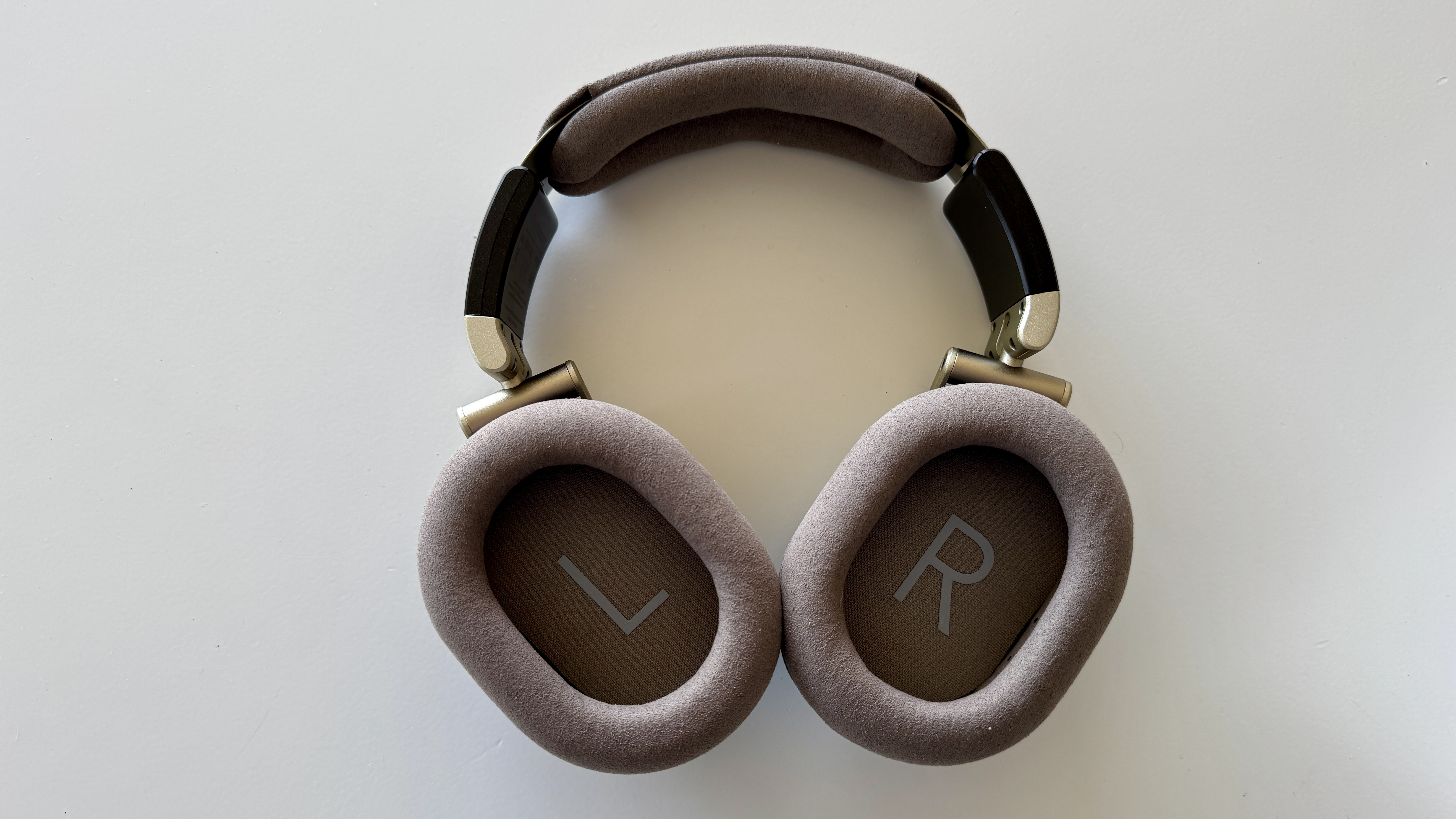 Inner ear cups of the Austrian Audio The Arranger over-ear headphones, on a white surface