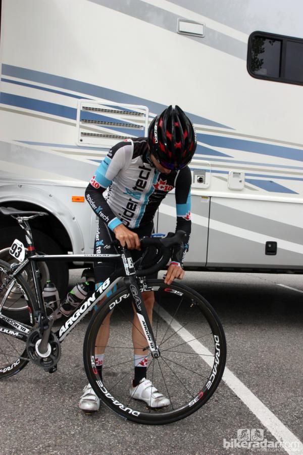 Spidertech rider Lucas Euser checks his tire pressure before departing Breckenridge.