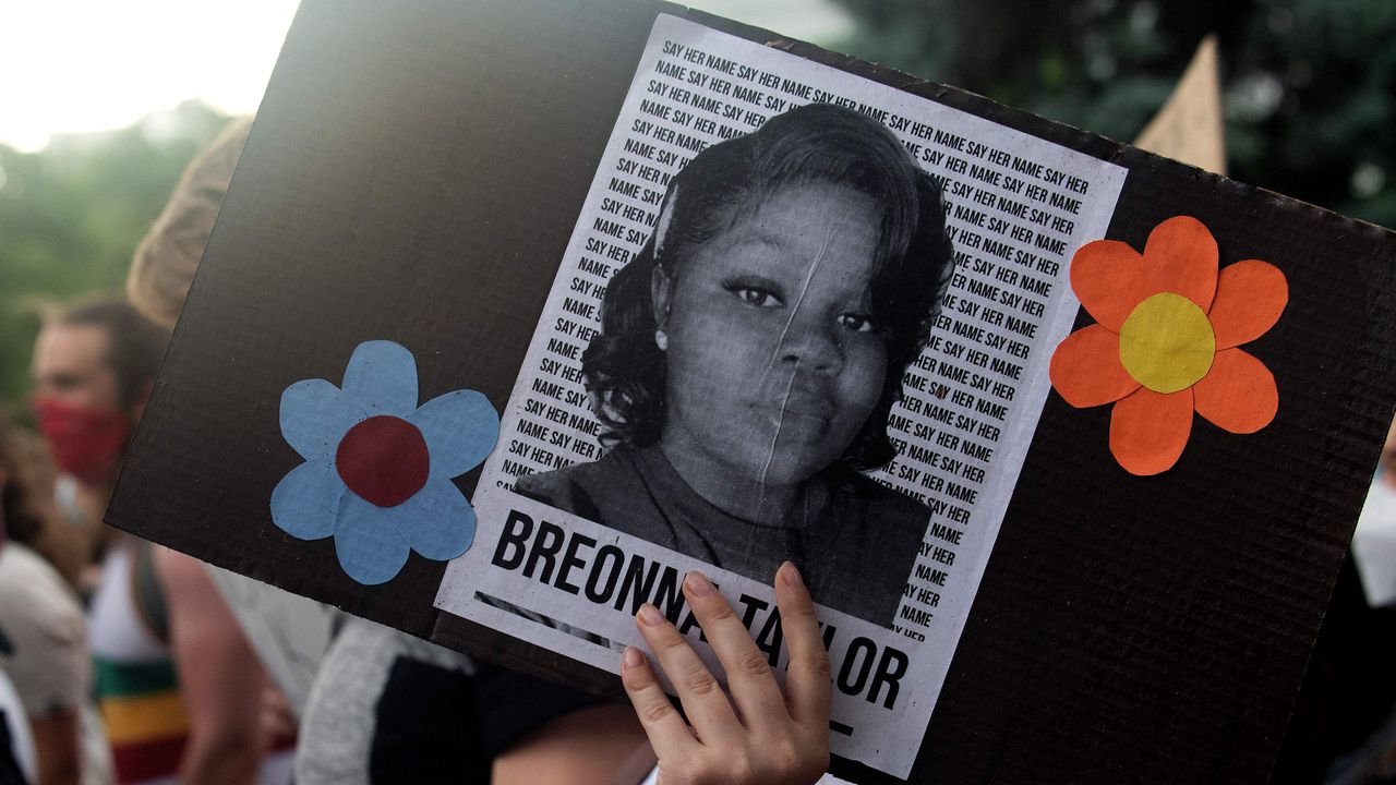 a demonstrator holds a sign with the image of breonna taylor, a black woman who was fatally shot by louisville metro police department officers, during a protest against the death george floyd in minneapolis, in denver, colorado on june 3, 2020 us protesters welcomed new charges brought wednesday against minneapolis officers in the killing of african american man george floyd but thousands still marched in cities across the country for a ninth straight night, chanting against racism and police brutality photo by jason connolly afp photo by jason connollyafp via getty images