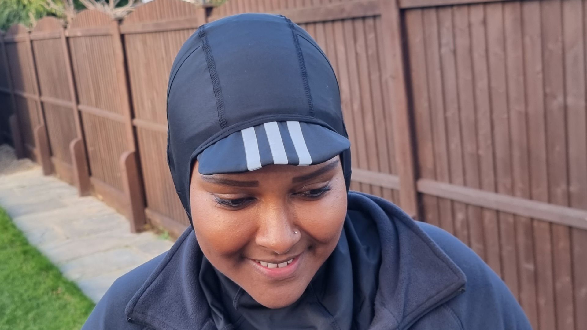 Image shows cyclist wearing Adidas Cycling Hijab