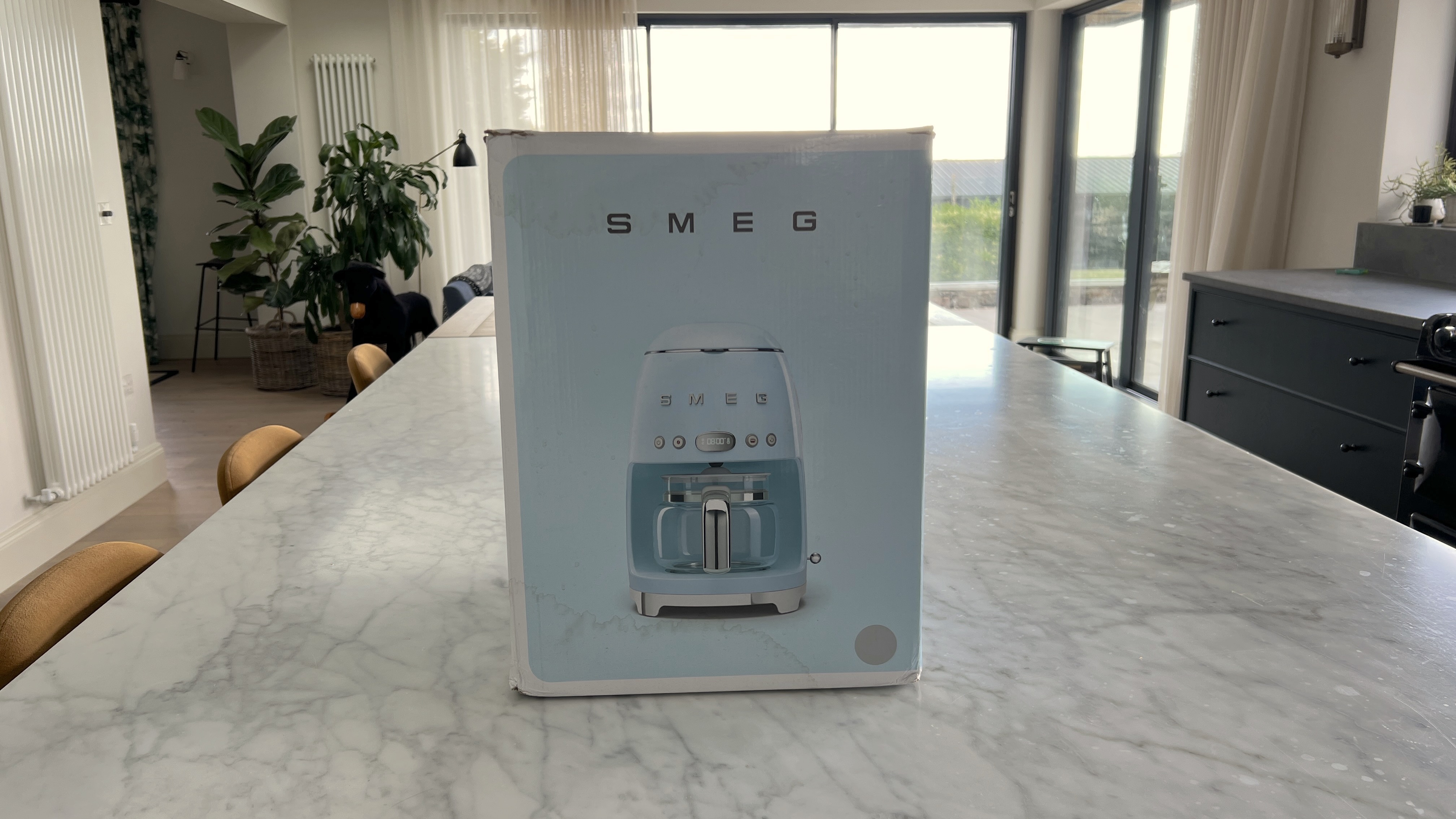 Smeg coffee machine packaging on counter