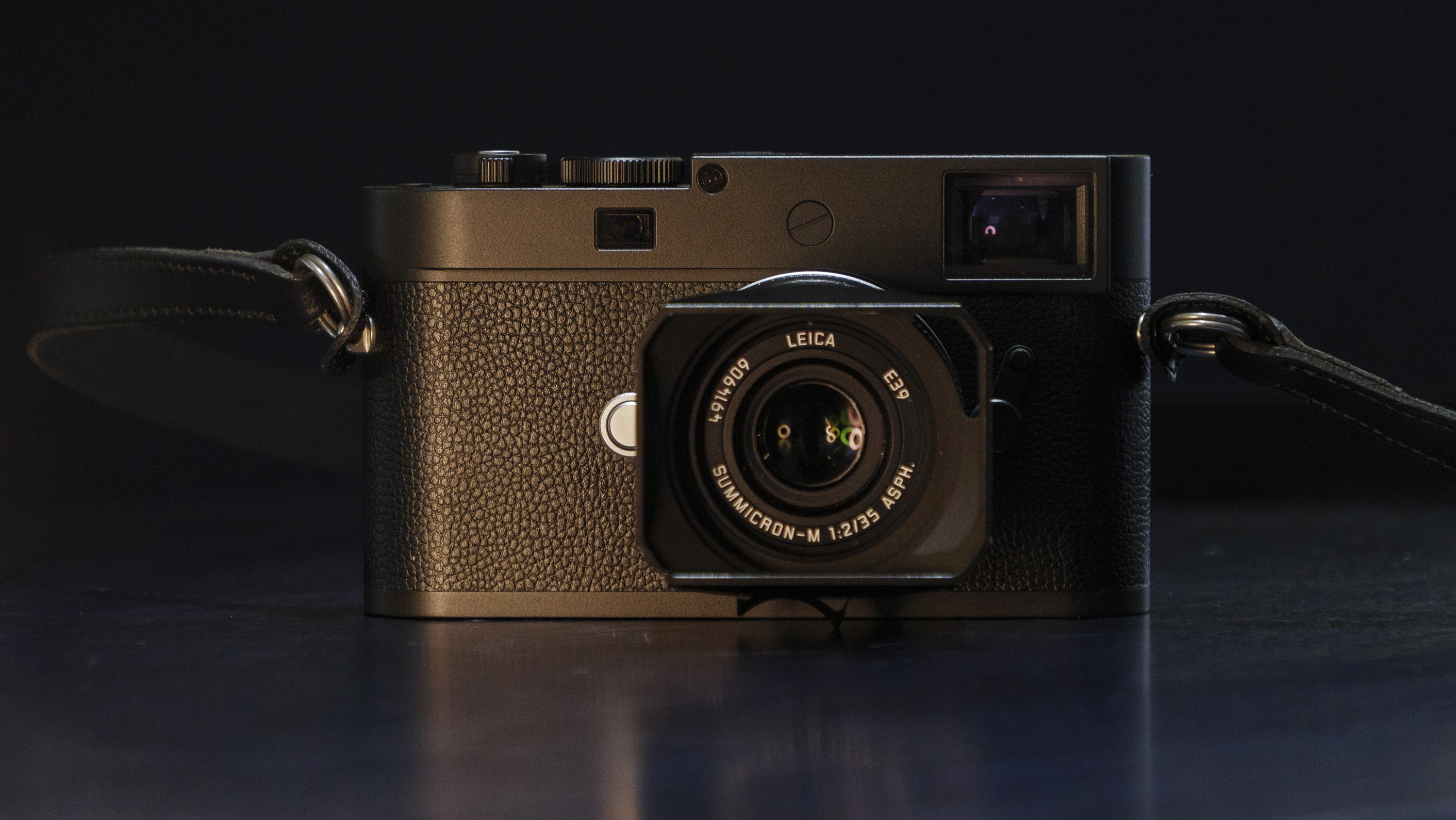 Leica M11-D camera on a dark blue table, low key lighting